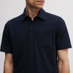 SEVE Dublin Pocket Polo_Navy Blue_front - Talk Golf Ireland Close-up of a person wearing a dark navy polo shirt with buttoned placket and chest pocket.