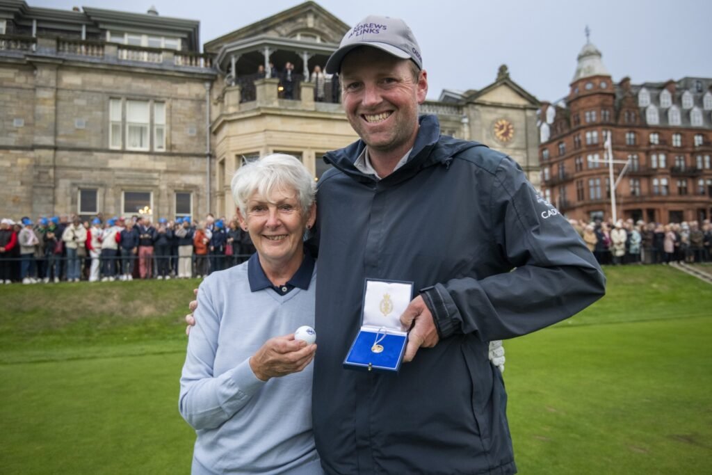 Claire Dowling 1 - Talk Golf Ireland Claire Dowling with caddie Dillon McCarron holding the traditional gold sovereign at St Andrews